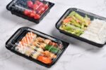 Black Single Compartment Trays With Sushi Rice And Vegetables