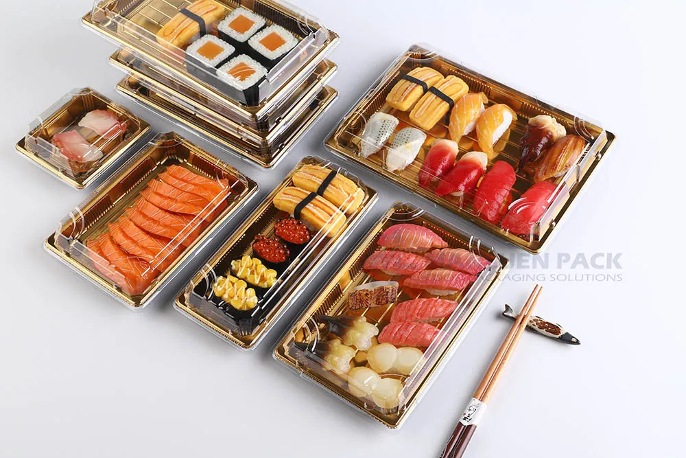 Manluen Gold Sushi Tray Range with Assorted Sushi Assorted sushi presented in multiple gold Manluen trays with clear lids