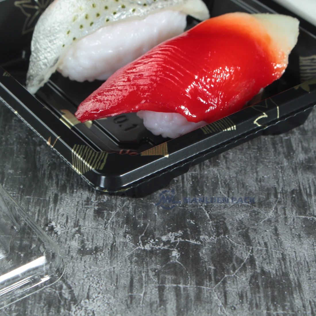 Detailed view of nigiri sushi inside a black WL-0.1 tray with clear cover