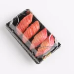 Salmon sushi packed in a black WL-00 tray with fitted clear lid