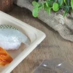 Close-up of sushi presented in a natural-color WL-01 bagasse tray
