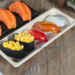 WL-01 bagasse sushi tray presenting assorted nigiri and gunkan sushi