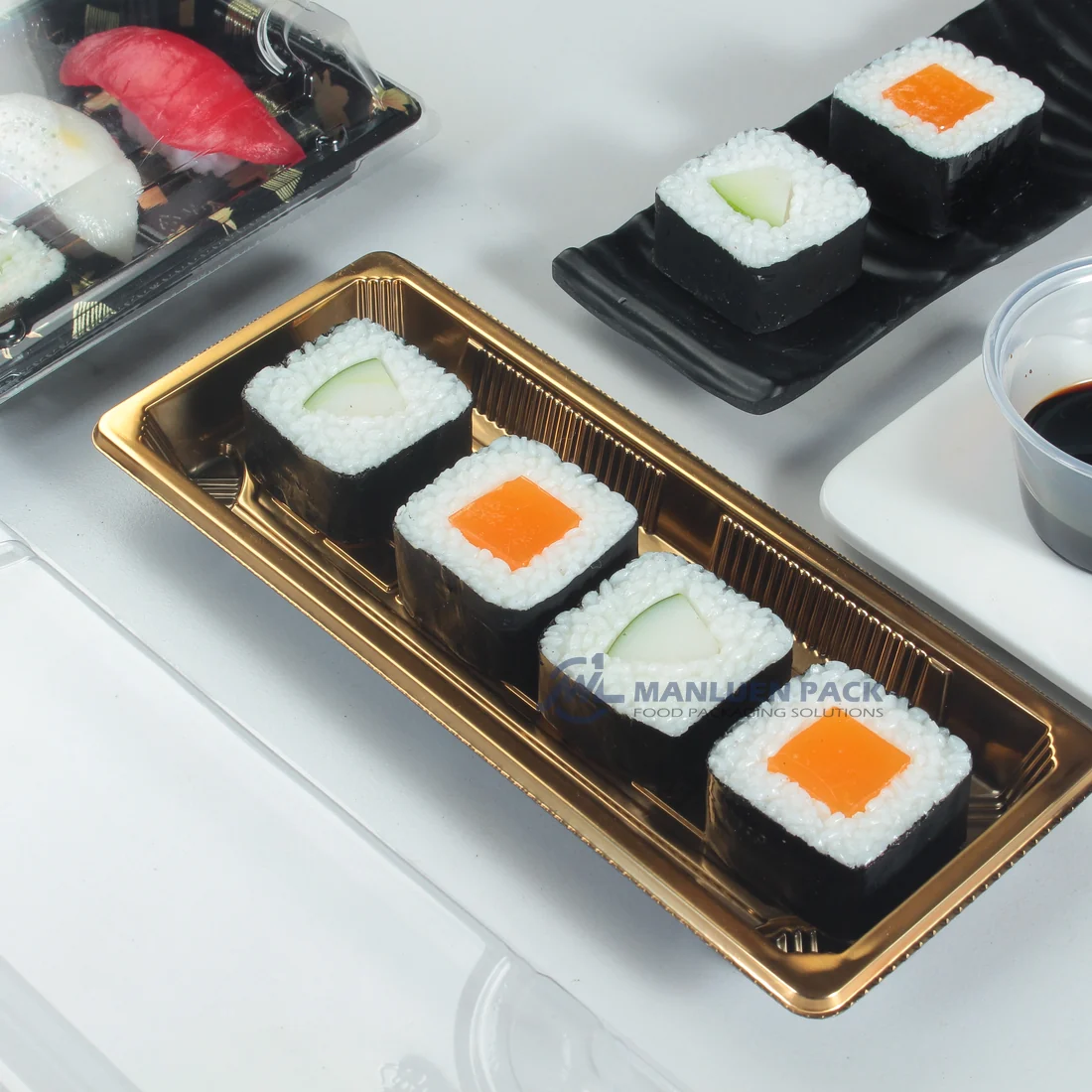 Gold WL-01 sushi tray presenting assorted sushi with clear lid nearby