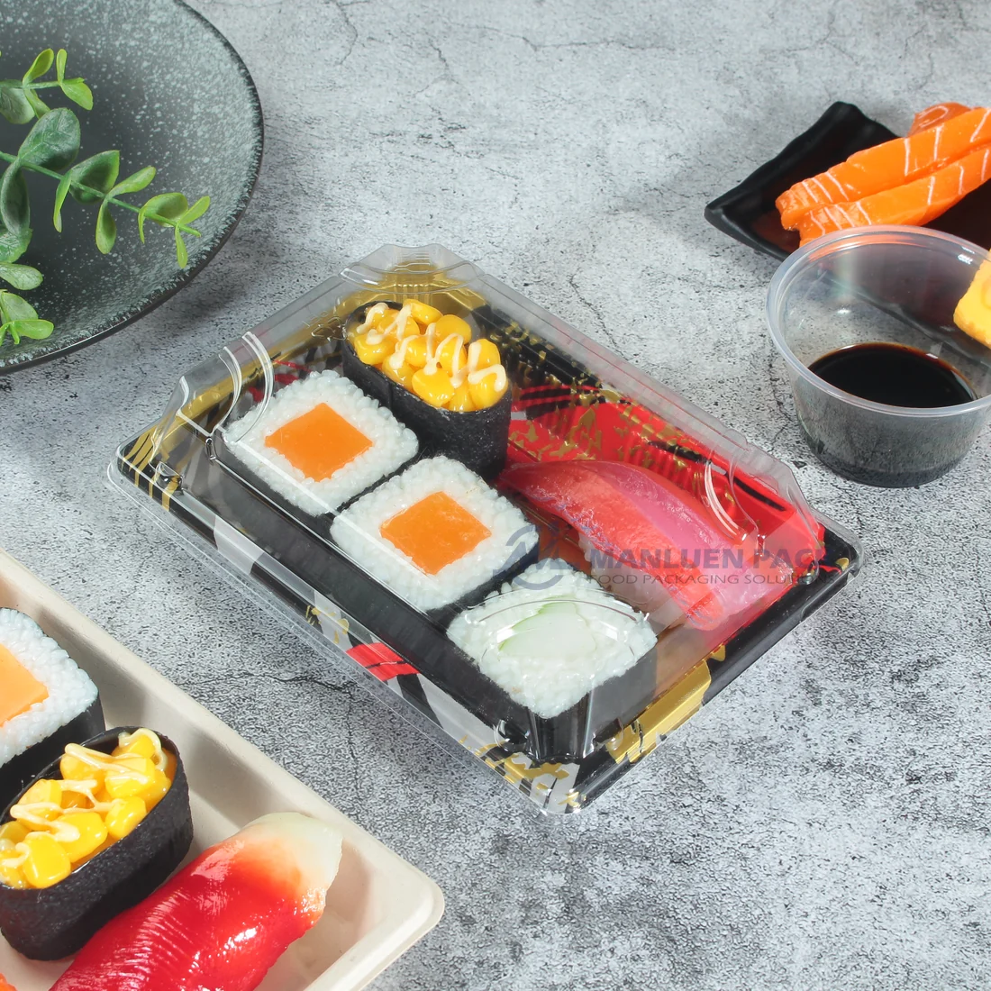 WL-03 Black Sushi Tray Lifestyle Setting | Manluen Pack Black WL-03 sushi tray with clear lid presented among assorted sushi in a lifestyle setting