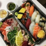 Sushi and sashimi served in decorative WL-09 takeaway trays