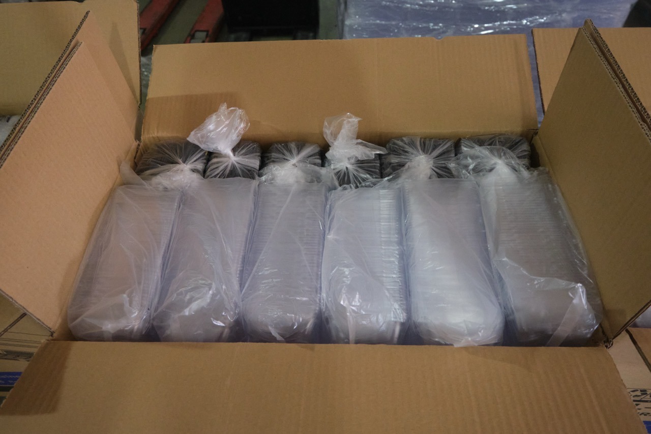 What Are the Three Types of Food Packaging? 2 Transparent plastic food packaging containers packed in a carton for transportation and warehouse storage.