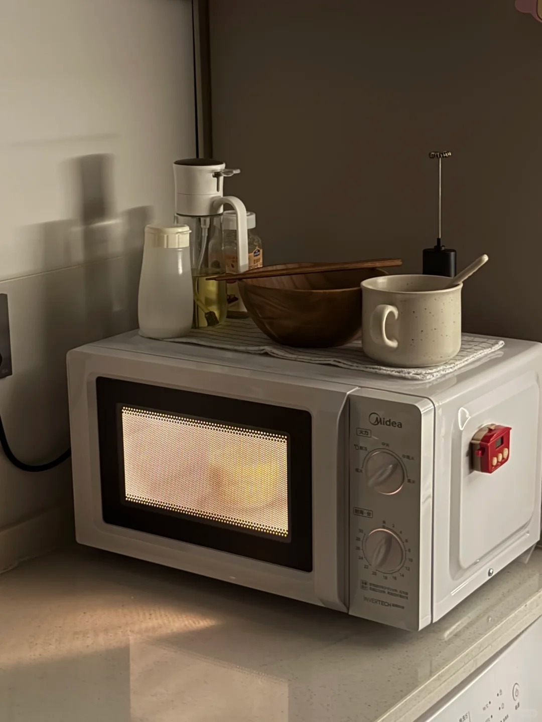 Microwave oven used for food heating in a home kitchen environment