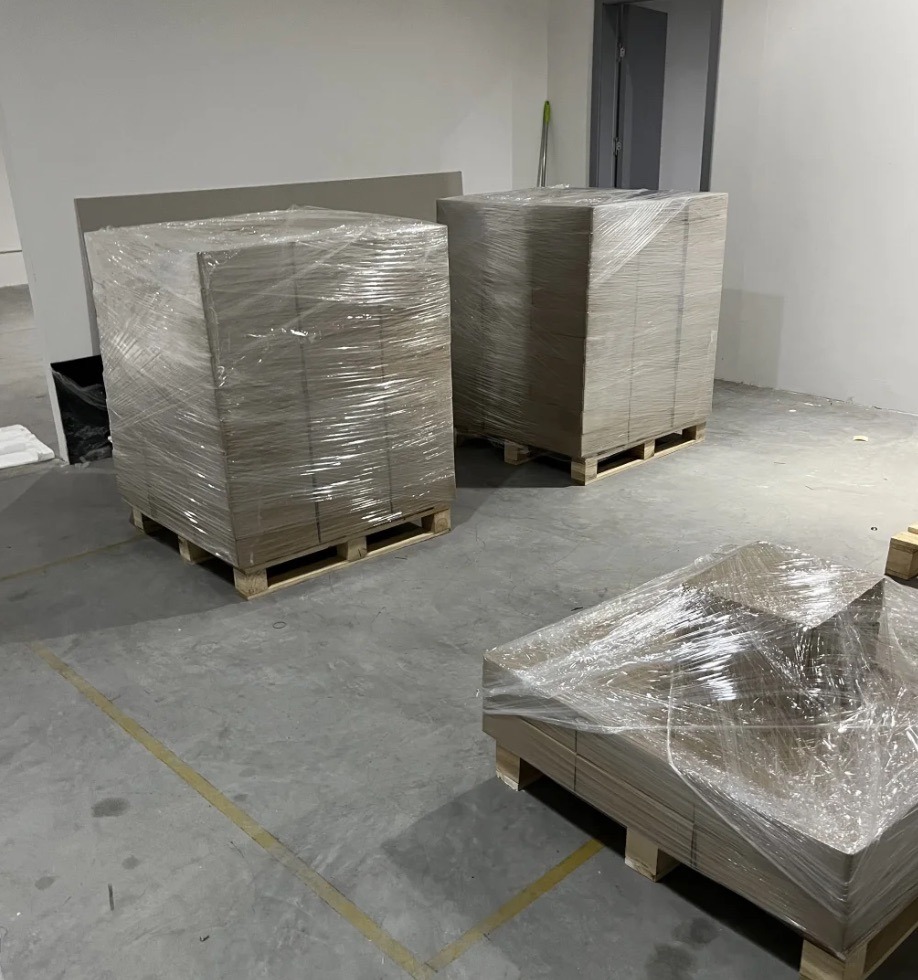 What Are the Three Types of Food Packaging? 5 Palletized products wrapped with stretch film as tertiary packaging for warehouse storage and transportation.