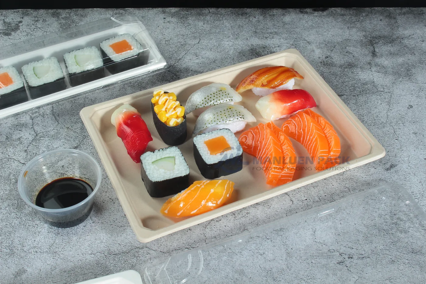 Open WL-11 bagasse sushi tray filled with assorted nigiri and rolls