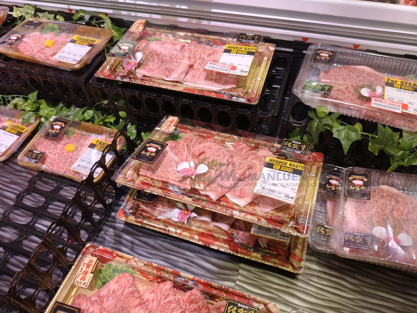 WL-11 sushi trays in multiple formats displayed in a refrigerated retail case