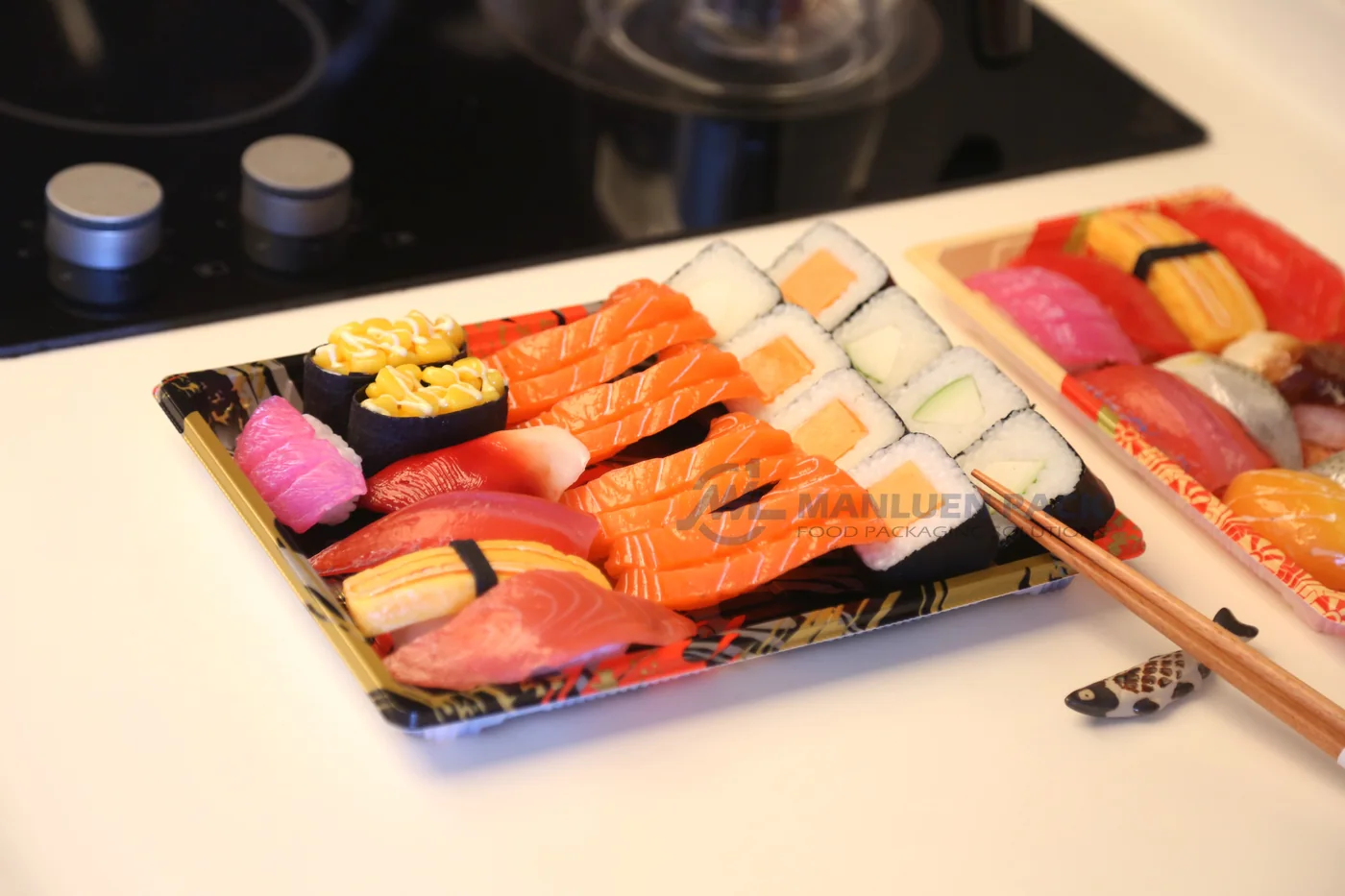 Open WL-11 sushi tray with assorted nigiri in a restaurant-style setting