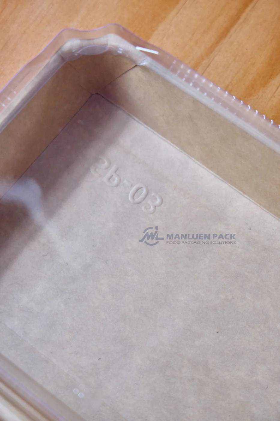 WL-1103 Kraft Paper Sushi Tray Base Detail | Manluen Pack Close-up of the natural kraft paper base and embossed marking on the WL-1103 sushi tray