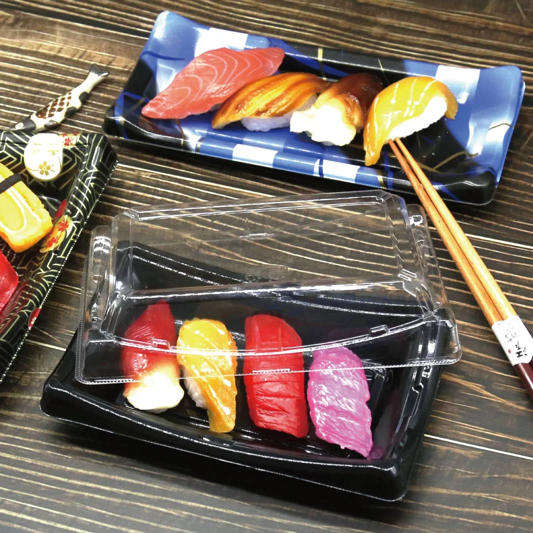 Covered WL-20B sushi tray with assorted nigiri in a dining setting