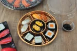 WL-250 sushi packaging shown in a open compartment sushi tray tabletop view