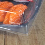 Close-up of the clear lid locking edge on a WL-40B sushi tray