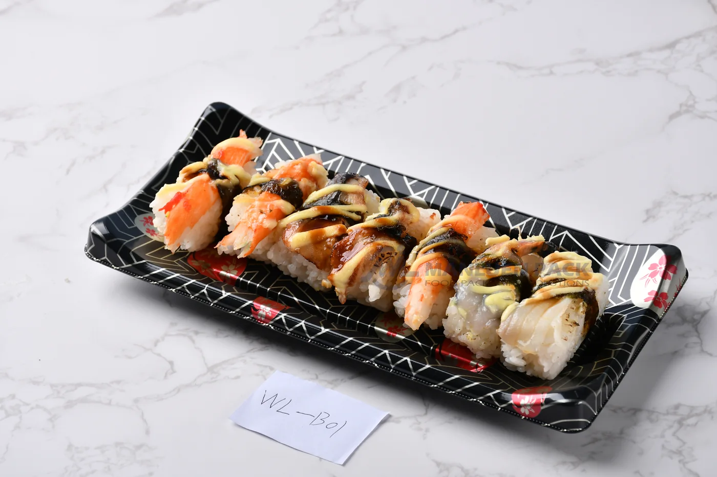 WL-B01 boat shape sushi tray shown in a sushi roll presentation on marble