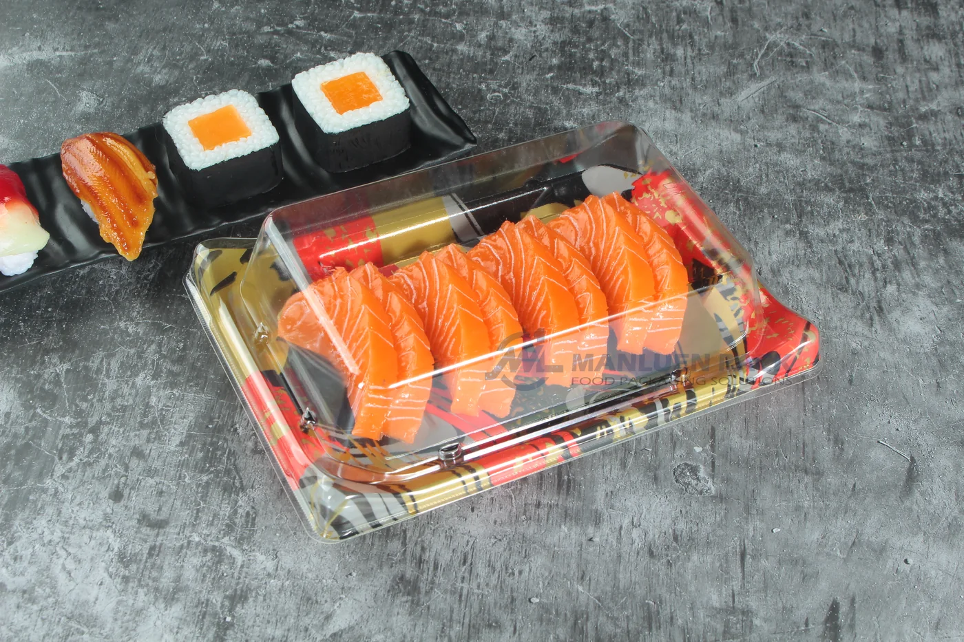 WL-B05 boat shape sushi tray shown in a covered salmon sushi tray dark tabletop view