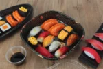 WL-C019 sushi packaging shown in a open square sushi tray alternative tabletop view