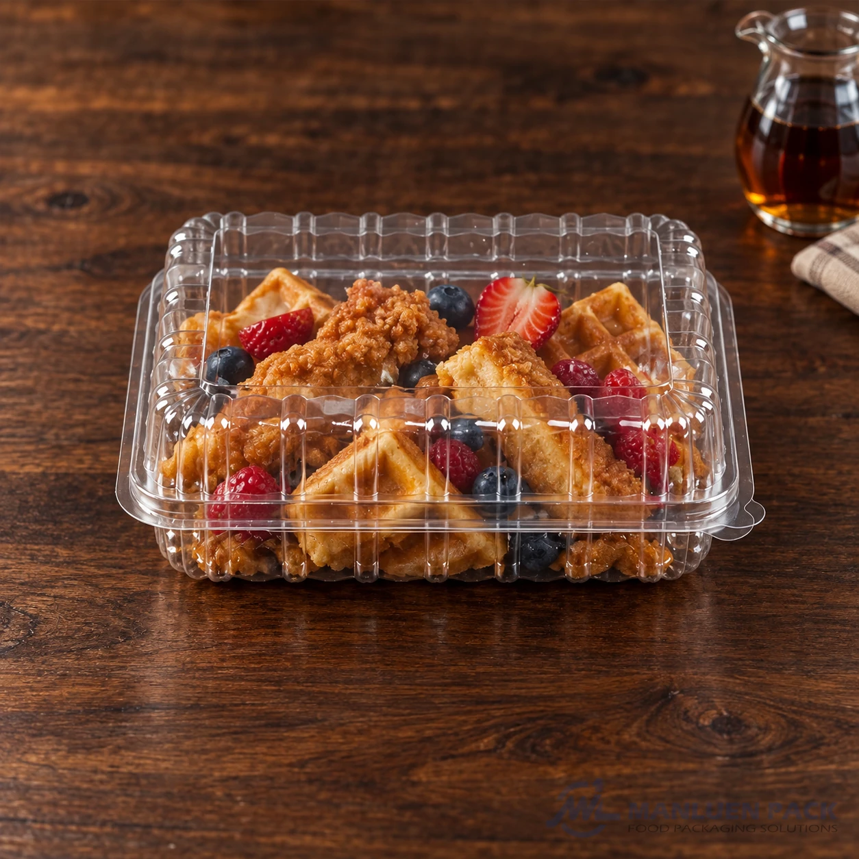 WL-CM003H closed plastic hinged clamshell food container filled with chicken and waffles in front view