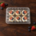 WL-CM003H closed plastic hinged clamshell food container filled with cupcakes and berries in top view