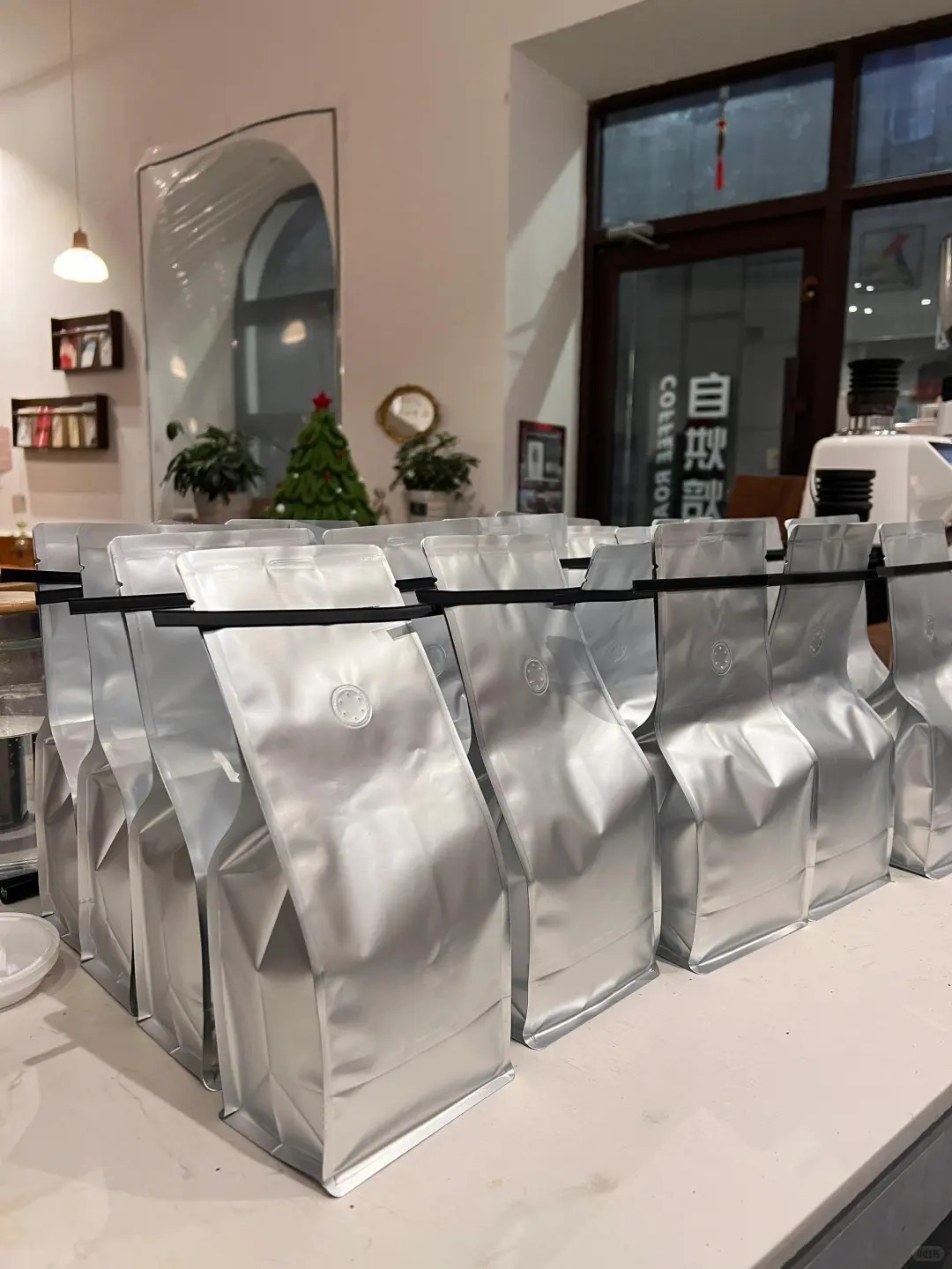 Is Aluminum Foil Safe for Food Packaging? A 2026 Buyer’s Guide 4 Silver stand-up foil pouches arranged on a countertop for food packaging and storage.