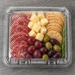 WL-CM004 closed plastic hinged clamshell food container filled with charcuterie in top view